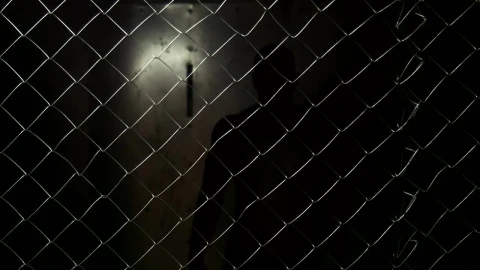 Stock Video A Shirtless Man Behind A Wire Fence Live Wallpaper For PC - Free Live Wallpaper