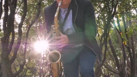 Stock Video A Saxophonist Dances While Playing Live Wallpaper For PC - Free Live Wallpaper