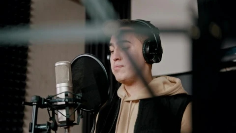 Stock Video A Rapper With Headphones Recording In The Studio Live Wallpaper For PC - Free Live Wallpaper