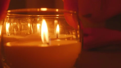 Stock Video A Persons Hand Accommodating Small Candles Live Wallpaper For PC - Free Live Wallpaper
