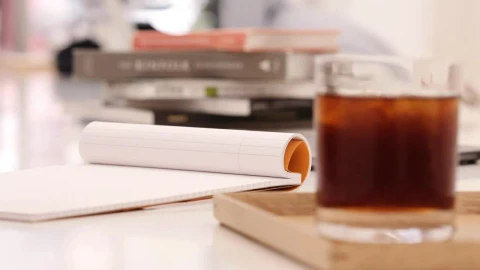 Stock Video A Person Writing On A Notebook At A Coffee Shop Live Wallpaper For PC - Free Live Wallpaper