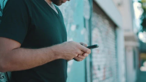 Stock Video A Person Texting On A Smartphone At The Street Live Wallpaper For PC - Free Live Wallpaper