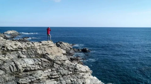 Stock Video A Person Taking Pictures Standing On A Cliff Live Wallpaper For PC - Free Live Wallpaper