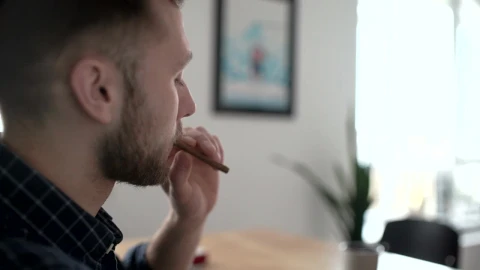 Stock Video A Person Smoking A Cigarette Indoors Live Wallpaper For PC - Free Live Wallpaper