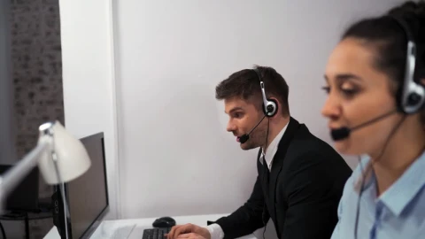 Stock Video A Pair Of Employees Working In A Call Center Live Wallpaper For PC - Free Live Wallpaper