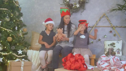 Stock Video A Mother With Her Two Daughters On Christmas Day Live Wallpaper For PC - Free Live Wallpaper