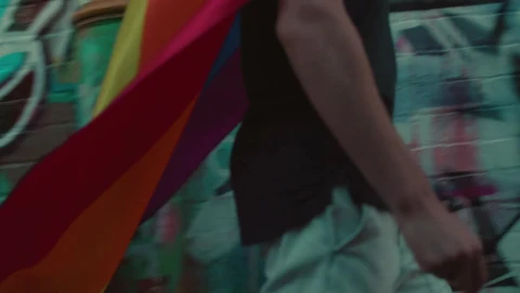 Stock Video A Man With A Rainbow Flag Walking In The Street Live Wallpaper For PC - Free Live Wallpaper