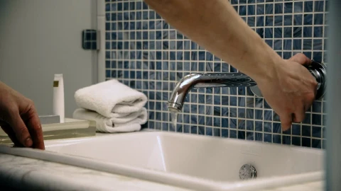 Stock Video A Man Washes His Face In The Bathroom Sink Live Wallpaper For PC - Free Live Wallpaper