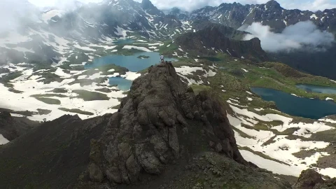 Stock Video A Man Standing On A Mountain Peak Looking At The Live Wallpaper For PC - Free Live Wallpaper