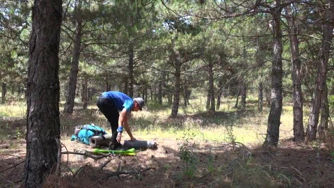 Stock Video A Man Setting Up A Camping Tent In The Woods Live Wallpaper For PC - Free Live Wallpaper
