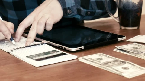Stock Video A Man Separating Money Into Budgets Live Wallpaper For PC - Free Live Wallpaper