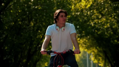 Stock Video A Man Riding A Bike Stops To Look At His Live Wallpaper For PC - Free Live Wallpaper