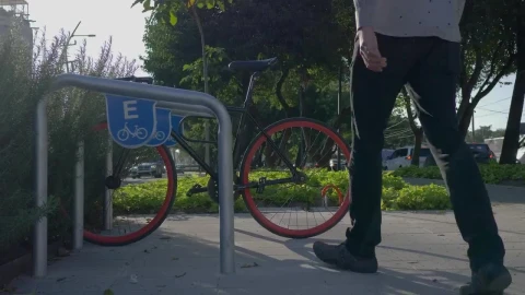Stock Video A Man Parking His Bicycle In The Street Live Wallpaper For PC - Free Live Wallpaper