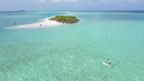 Stock Video A Man Paddling On A Board To Get To A Live Wallpaper For PC - Free Live Wallpaper