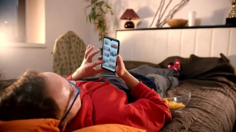 Stock Video A Man Lying On The Bed Scrolling On His Phone Live Wallpaper For PC - Free Live Wallpaper