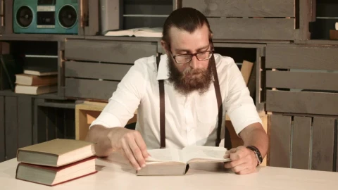 Stock Video A Man Is Reading A Book On The Table Live Wallpaper For PC - Free Live Wallpaper