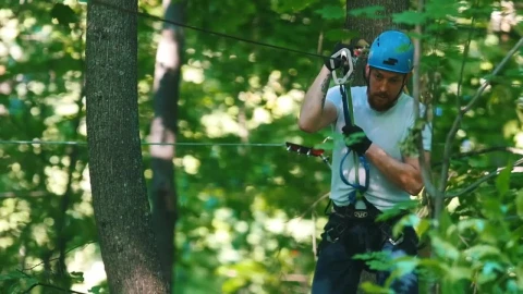 Stock Video A Man In A Security Helmet On A Rope Adventure Live Wallpaper For PC - Free Live Wallpaper