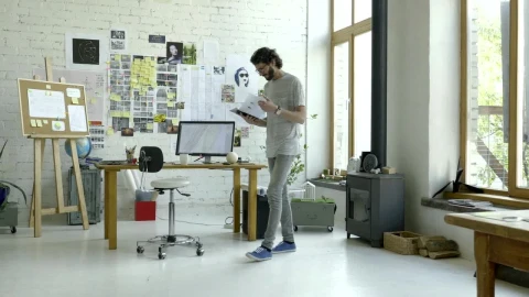 Stock Video A Man Checking His Notes In The Studio Live Wallpaper For PC - Free Live Wallpaper