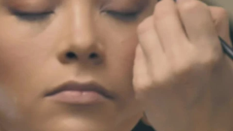 Stock Video A Makeup Artist With Face Mask Putting On Makeup Live Wallpaper For PC - Free Live Wallpaper