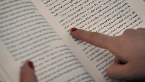 Stock Video A Girls Hand With A Book Following The Reading With Live Wallpaper For PC - Free Live Wallpaper