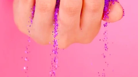Stock Video A Girls Hand Spilling Glitter On A Pink Background Live Wallpaper For PC - Free Live Wallpaper