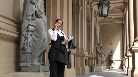 Stock Video Business Woman In The Exterior Hallway Of A Classic Building Live Wallpaper For PC - Free Live Wallpaper