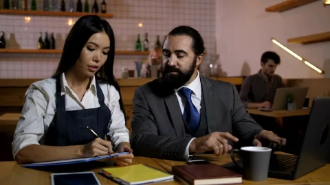 Stock Video Business Owner Assigning Tasks At A Cafe Live Wallpaper For PC - Free Live Wallpaper