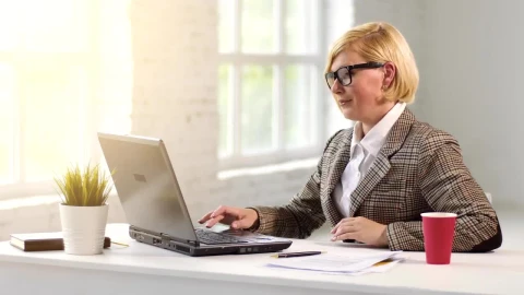 Stock Video Business Leader Works On Laptop And Sips Drink Live Wallpaper For PC - Free Live Wallpaper