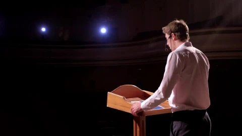 Stock Video Business Conference Speaker At Podium Gestures To Audience Live Wallpaper For PC - Free Live Wallpaper