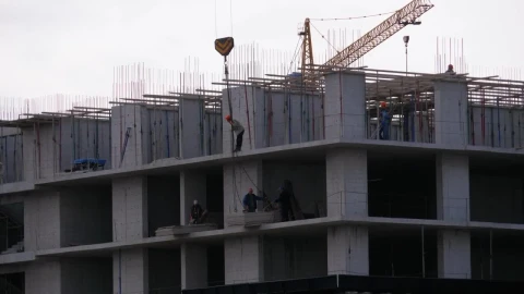 Stock Video Builders Lifting A Load In The Construction Site Live Wallpaper For PC - Free Live Wallpaper