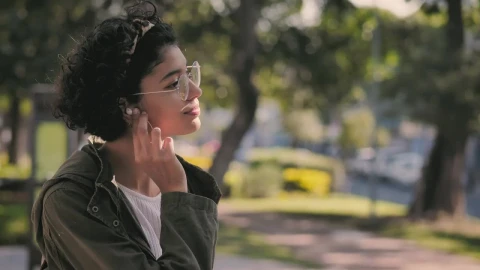 Stock Video Brunette Teen Puts On Her Headphones And Smiles Live Wallpaper For PC - Free Live Wallpaper