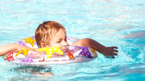 Stock Video Boy Swimming With A Plastic Ring Live Wallpaper For PC - Free Live Wallpaper