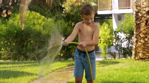 Stock Video Boy Spraying A Garden Hose Live Wallpaper For PC - Free Live Wallpaper