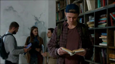 Stock Video Boy Reading A Book In A Library Live Wallpaper For PC - Free Live Wallpaper