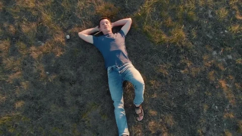 Stock Video Boy Lying Outdoors Top Zoom Out Aerial Shot Live Wallpaper For PC - Free Live Wallpaper
