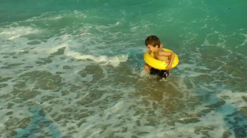 Stock Video Boy In The Seashore With A Floaty Live Wallpaper For PC - Free Live Wallpaper