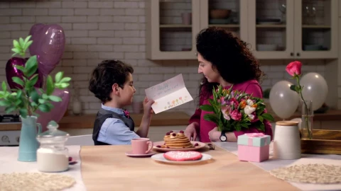 Stock Video Boy Giving His Mother A Card Live Wallpaper For PC - Free Live Wallpaper