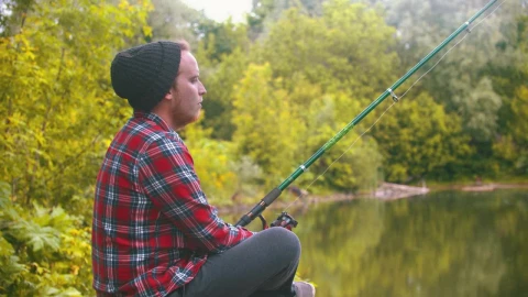 Stock Video Bored Young Man Fishing In The Forest Live Wallpaper For PC - Free Live Wallpaper