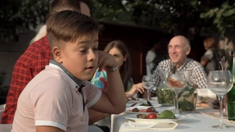 Stock Video Bored Boy On A Family Dinner Live Wallpaper For PC - Free Live Wallpaper