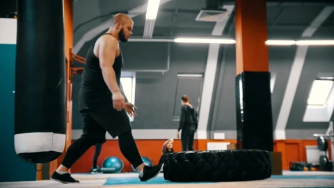Stock Video Bodybuilder Flips A Tire On The Gym Floor Live Wallpaper For PC - Free Live Wallpaper
