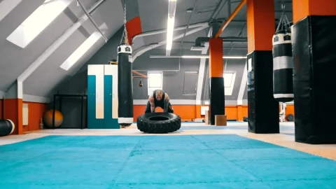 Stock Video Bodybuilder Flips A Tire On The Floor Over And Over Live Wallpaper For PC - Free Live Wallpaper