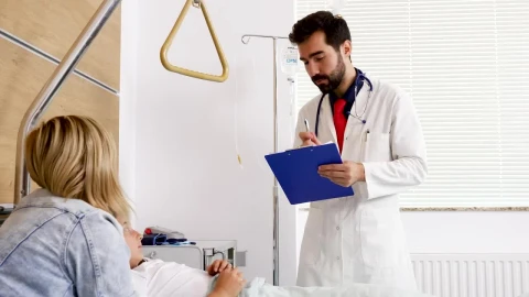 Video Stock Child In Hospital Smiles At Doctor Holding Clipboard Live Wallpaper For PC - Free Live Wallpaper