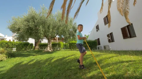 Video Stock Child Holding A Garden Water Hose Live Wallpaper For PC - Free Live Wallpaper
