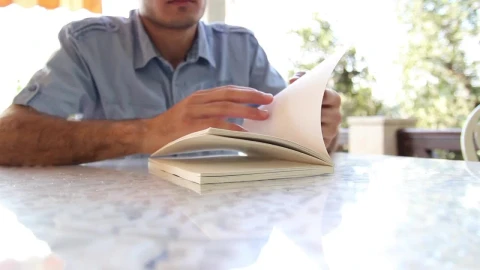 Video Stock Chico Leafing Through A Book To Start Reading Live Wallpaper For PC - Free Live Wallpaper