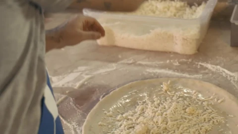 Video Stock Chef Tossing Grated Cheese On A Pizza Live Wallpaper For PC - Free Live Wallpaper
