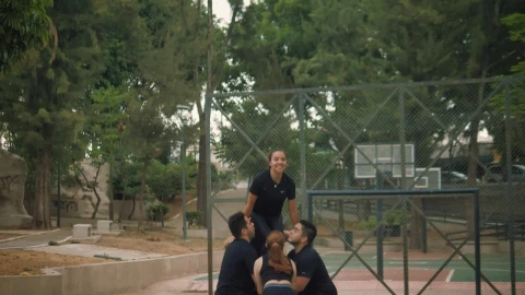 Video Stock Cheerleaders Throwing A Girl Into The Air At A Workout Live Wallpaper For PC - Free Live Wallpaper