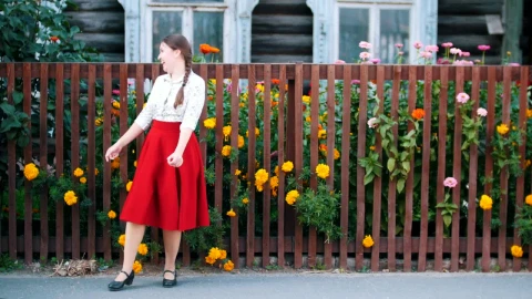Video Stock Cheerful Girl Dancing In Front Of A Garden Fence Live Wallpaper For PC - Free Live Wallpaper