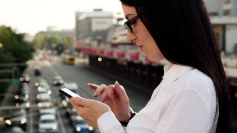 Video Stock Checking Her Phone On A Bridge Live Wallpaper For PC - Free Live Wallpaper