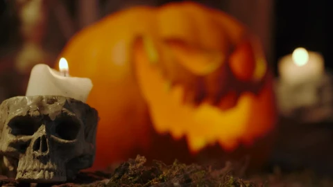 Video Stock Candles On The Sides Of A Lighted Halloween Pumpkin Live Wallpaper For PC - Free Live Wallpaper