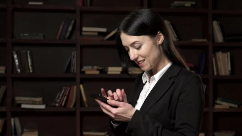 Video Stock Businesswoman Texting In The Library Live Wallpaper For PC - Free Live Wallpaper